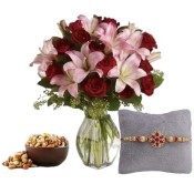 Rakhis with Bouquet Of Roses and Lilies With Mixed Dry Fruits